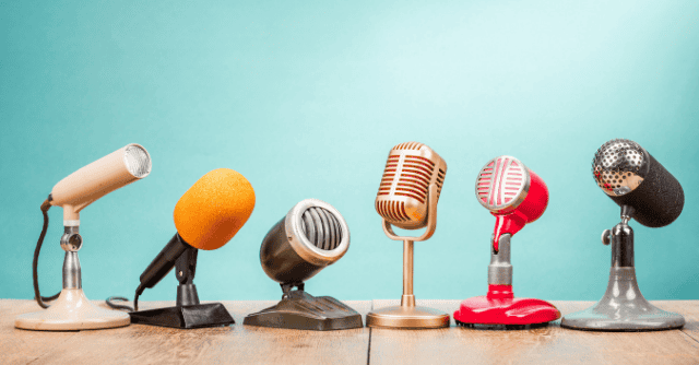 six different microphones sitting on a table